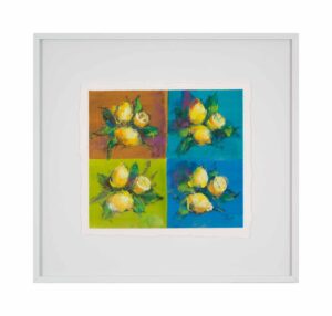 Four bunches of lemons against different colored block backgrounds create a mesmerizing display of pastels.